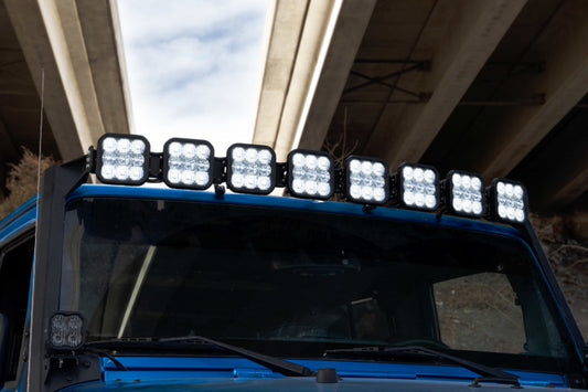 Diagonal view of Diode Dynamics Jeep JK SS5 Sport CrossLink Windshield Yellow Combo Lightbar kit with yellow and clear LED lightbars.