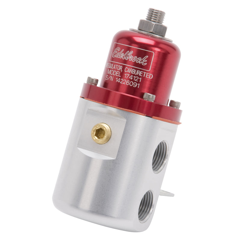 Edelbrock fuel pressure regulator for carbureted engines, 5-10 PSI, red and clear, with 3/8 inch inlet and outlet fittings.