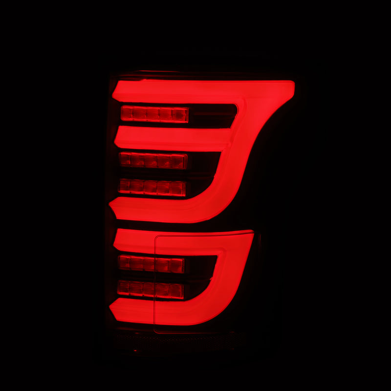 AlphaRex Luxx-Series LED tail lights for Ford F150 2015-2020 in black finish, showcasing sleek design and bright LED illumination.