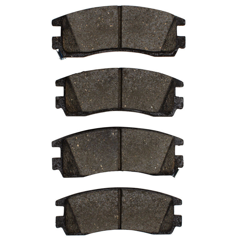 R1 Concepts ceramic brake pads for Buick Regal R1 91-05 rear, OE style, with metal backing and branding markings.