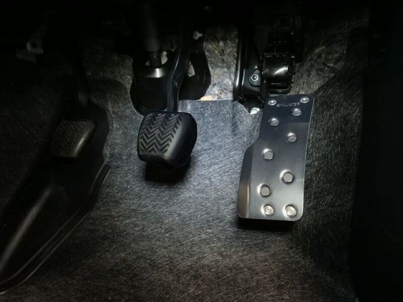 Cusco wide accelerator pedal cover kit for 2023+ Toyota GR Corolla and 2020+ GR Yaris, made of durable material, installed on vehicle.