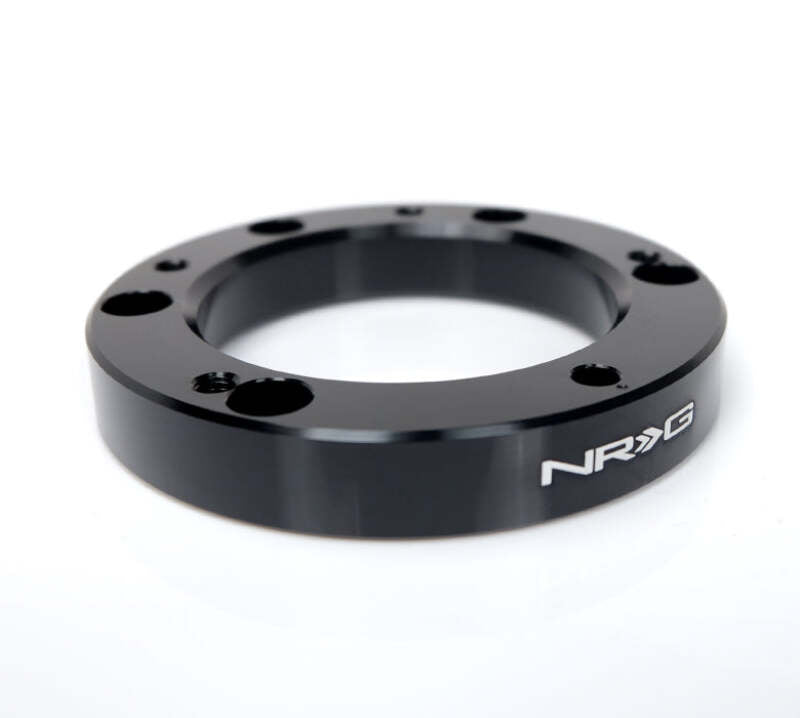 NRG 6 hole to 5 hole steering wheel hub adapter showing metal hub with bolt holes for car steering wheel installation.