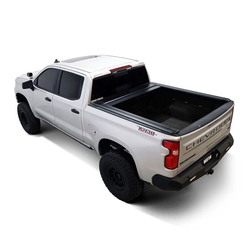 Westin 19-26 GM Silverado/Sierra 1500 black roll-up retractable tonneau cover on truck bed, manual operation