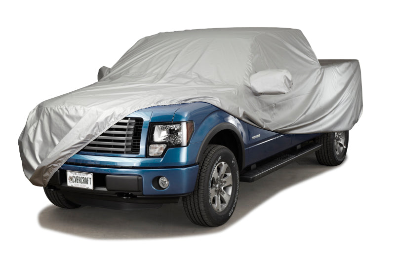 Covercraft silver custom truck cover for Toyota Tacoma cab area, designed to protect and fit 2022-2025 models.