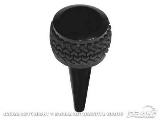 Black DV8 Offroad Jeep JK 2011-2018 automatic shift knob, close-up view showing textured grip and sleek design.