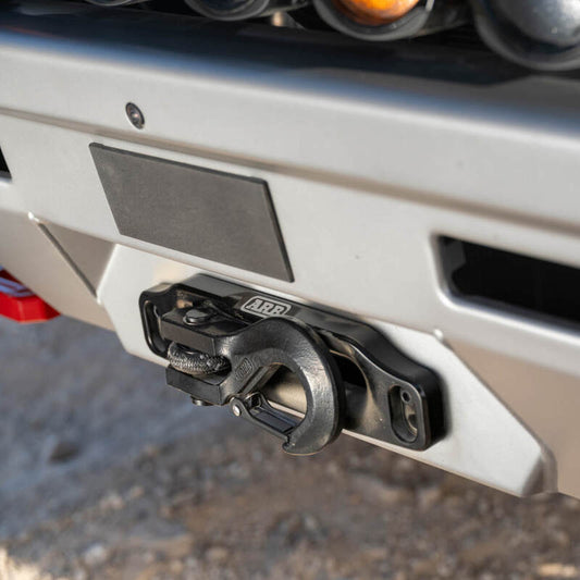ARB Land Cruiser 250 Zenith winch bar installed on vehicle, showcasing durable steel construction and mounting points for winching.