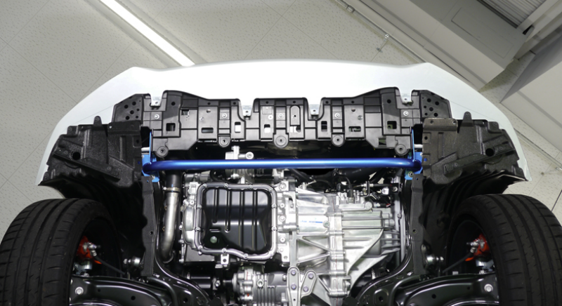 Cusco front power brace for 2020+ Toyota Yaris and GR Yaris chassis bracing, excluding 1.5L FWD model, installed on vehicle.