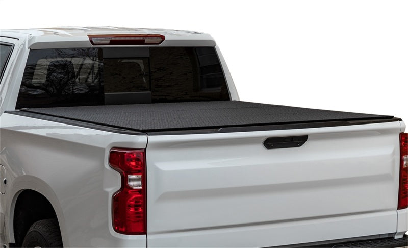 Access LOMAX Pro Series tri-fold hard tonneau cover for Chevy/GMC 1500 6ft 6in bed, black diamond mist finish.