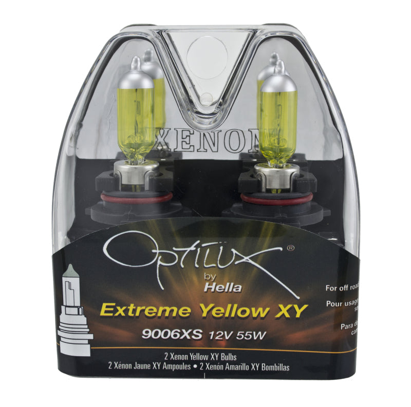Pair of Hella 9006XS 12V 55W Xen Pure Yellow bulbs for improved visibility in automotive headlights.