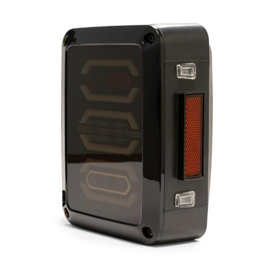 DV8 Offroad Jeep Wrangler JK octagon LED tail light, rear view showing bright red lens and mounting hardware.