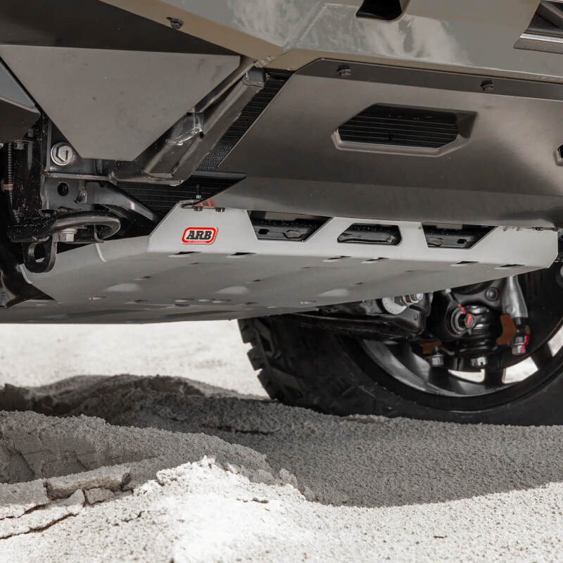 ARB 2024+ Toyota Tacoma front skid plate, durable protective off-road skid plate for Tacoma trucks, black metal with mounting points.