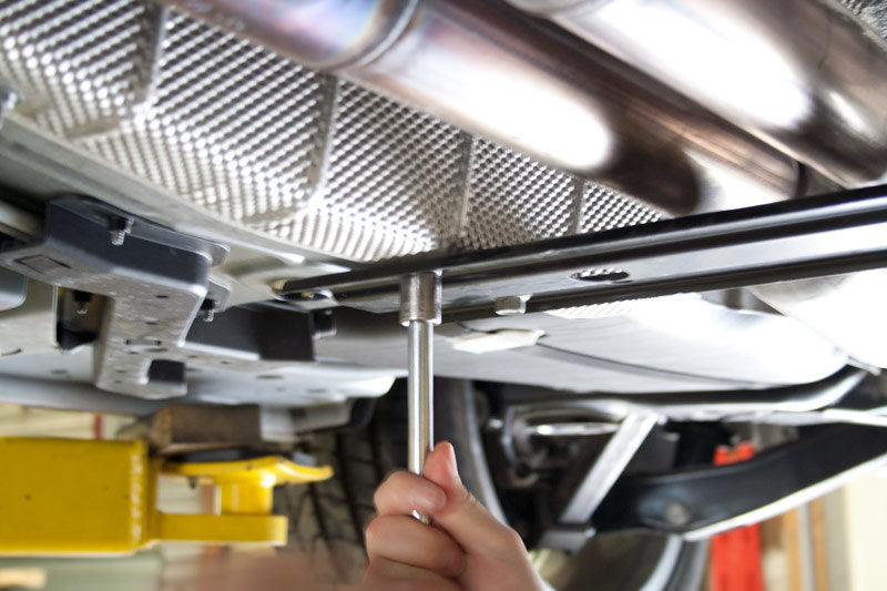 UBI Performance Pontiac G8 and Camaro tunnel brace suspension component shown in close-up, designed for vehicle stability and support.