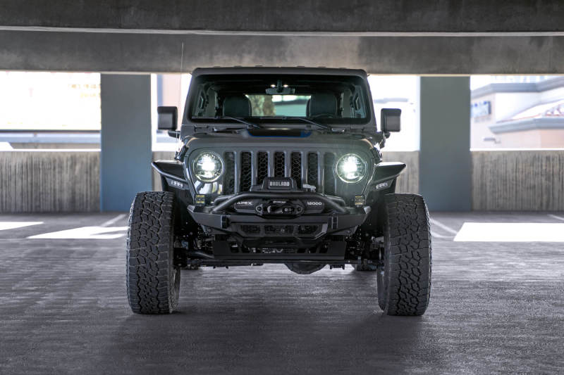 DV8 Offroad Jeep Wrangler JL Spec Series tube fenders, black metal with rugged design, installed on a Jeep Wrangler JL.