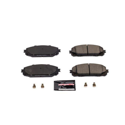 PowerStop Z23 Evolution Sport brake pads with hardware installed in a Jeep Cherokee front brake assembly.