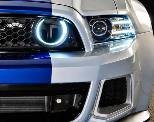 Oracle Ford Mustang 2010-2013 white LED fog halo grille kit installed in the front grille area.