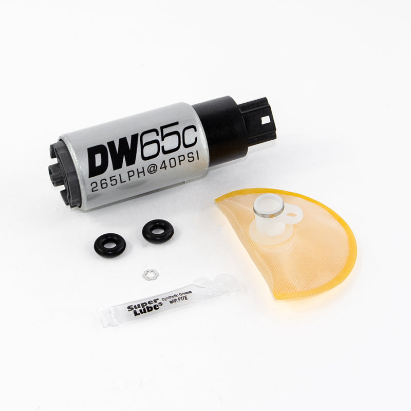 DeatschWerks DW65C compact fuel pump for 2007-2013 Holden Commodore Gen IV 6.0L V8, with install kit on a workbench.