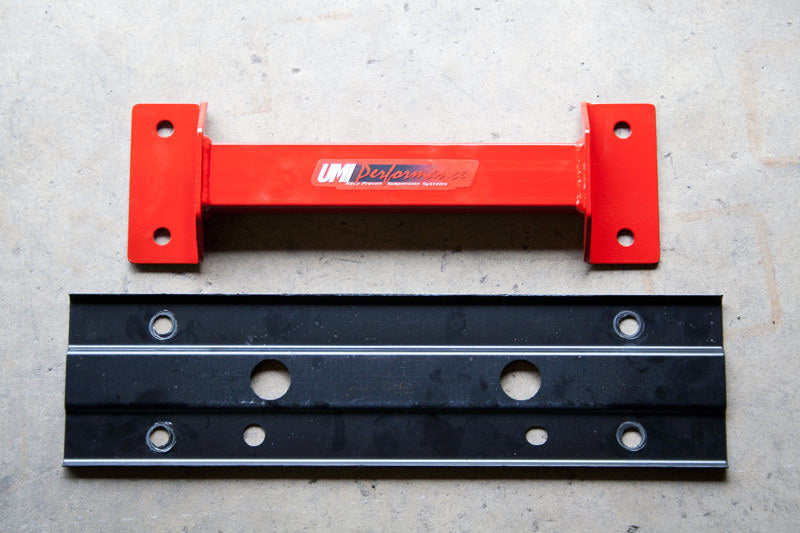 UMI Performance suspension tunnel brace for 2008-2009 Pontiac G8 and 2010-2013 Camaro, showing the sturdy metal component in close-up.