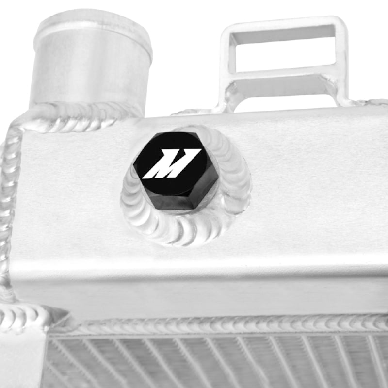 Mishimoto 07-09 Nissan 350Z manual aluminum radiator, side view showing sleek design and cooling fins for optimal engine performance.
