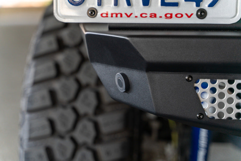 Steel rear bumper for 2018 Jeep Wrangler JL by DV8 Offroad, featuring the MTO Series design and optional tire carrier attachment.