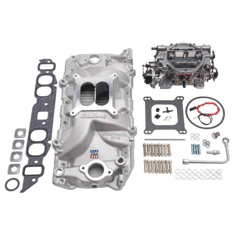 Edelbrock Performer RPM Big Block Chevrolet oval port intake manifold and carburetor kit in natural finish for high-performance engine setup.