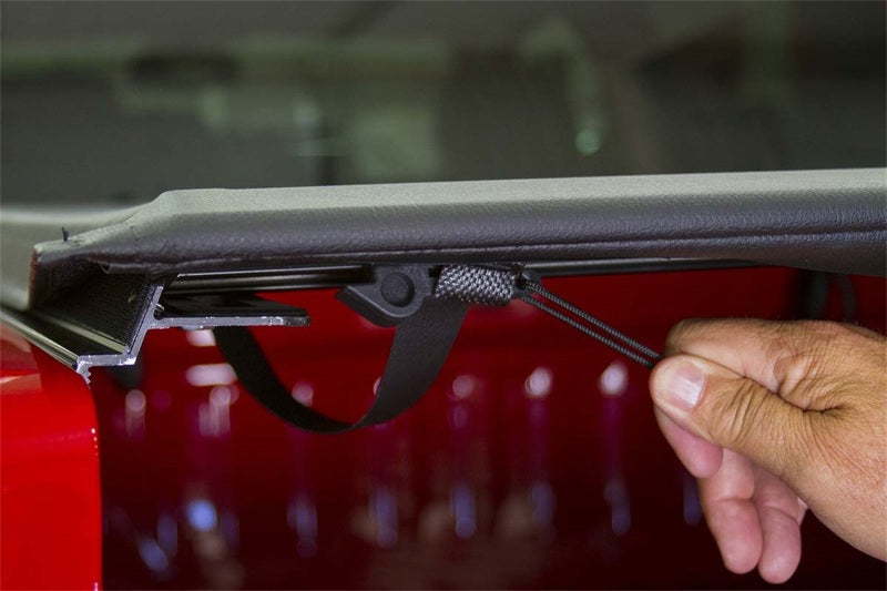 Access Literider roll-up truck bed cover on a Ford Explorer Sport Trac 4-door with 4ft 2in bed, bolt-on installation.