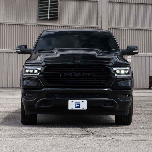 Pair of FORM Lighting Ram 1500 projector headlights with sequential LED design, showcasing modern automotive headlight technology.