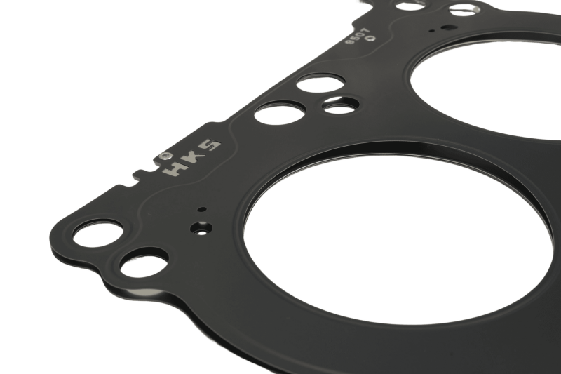 HKS stopper type head gasket FA24 t0.7 for engine sealing, shown in the image with detailed gasket design and branding.