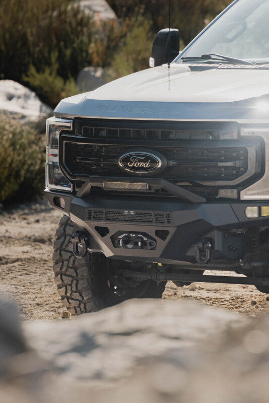 Steel front bumper for Ford Super Duty F-250/F-350 by DV8 Offroad, rugged and durable with a sleek design.