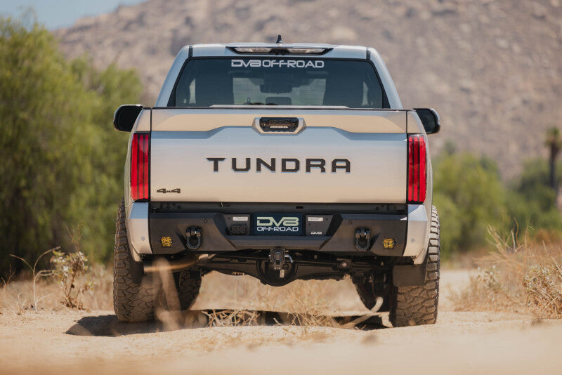 Steel rear bumper for Toyota Tundra DV8 Offroad Spec Series, rugged design with mounting points and durable finish.