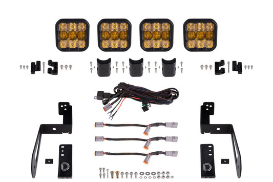 Diode Dynamics Jeep JK SS5 4-Pod CrossLink grille lightbar kit with yellow combo lights on black grille, off-road vehicle lighting system