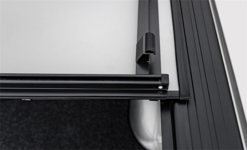 Access LOMAX Stance hard cover in black urethane on a Chevy/GMC full-size 1500 truck with 5ft 8in bed, exterior truck bed accessory.