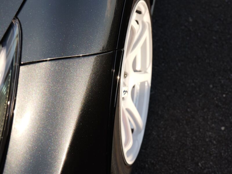 HKS GR Corolla GZEA14H body kit fender molding installed on a car, showcasing sleek exterior styling and precise fitment