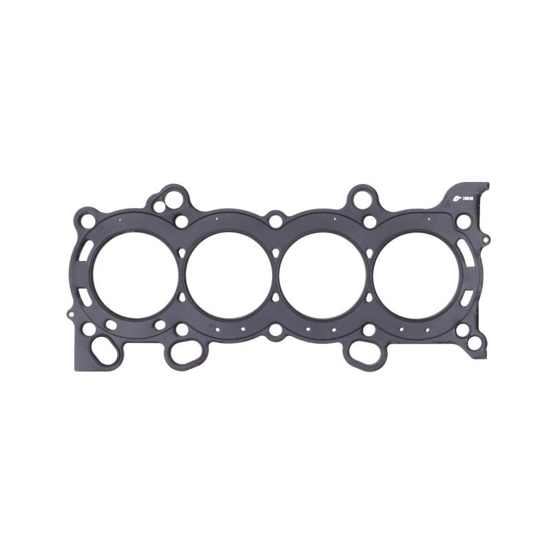 Cometic Honda K20/K24 86mm MLS head gasket, .030 inch thickness, showing the gasket's surface with sealing rings and metal layers.