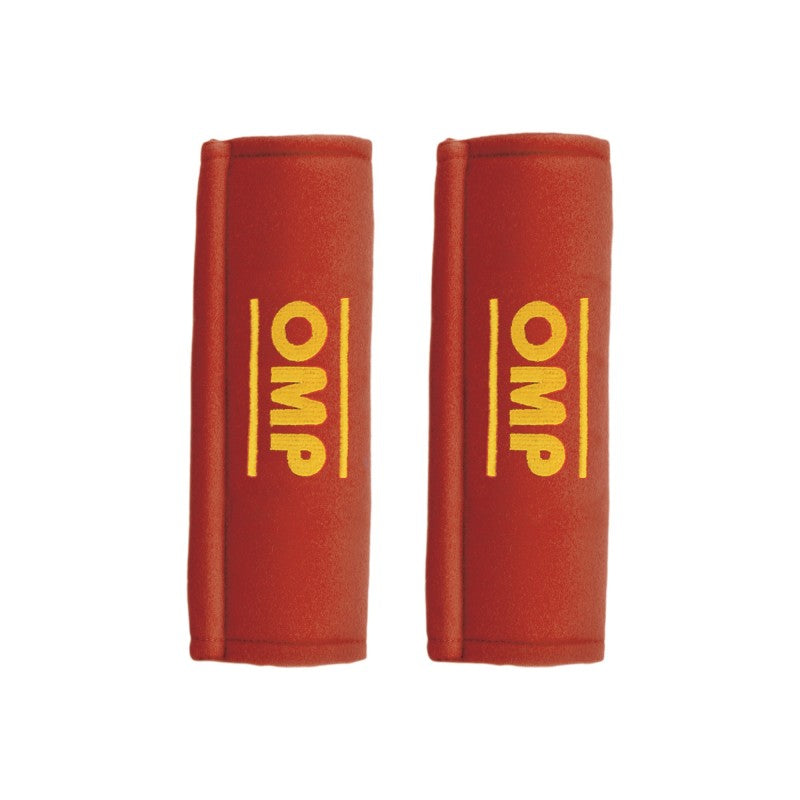 Pair of red OMP belt pads for safety harnesses, providing comfort and cushioning for 2-inch straps.