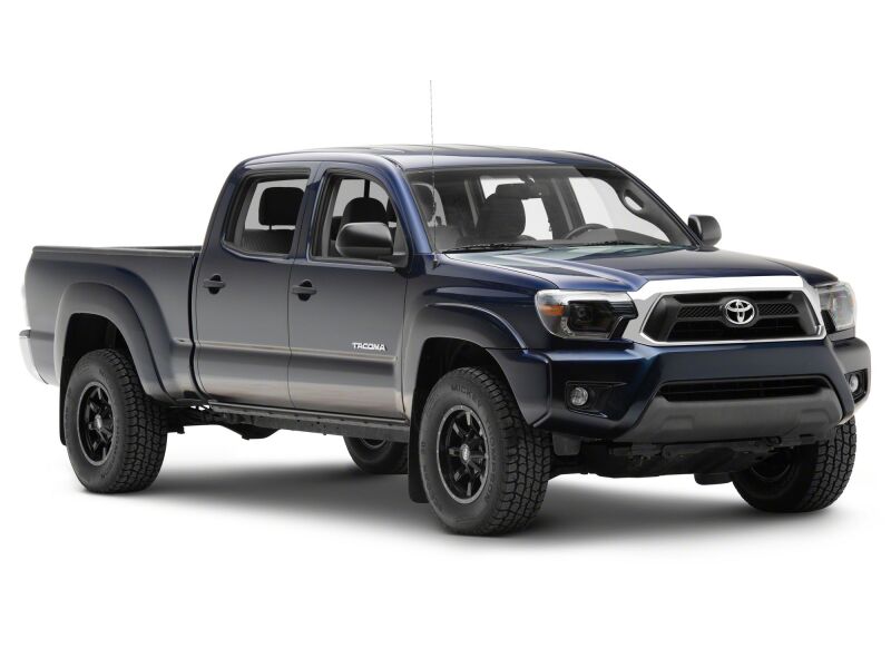 Raxiom Toyota Tacoma 12-15 axial series switchback projector headlights with black housing and clear lens, front view.