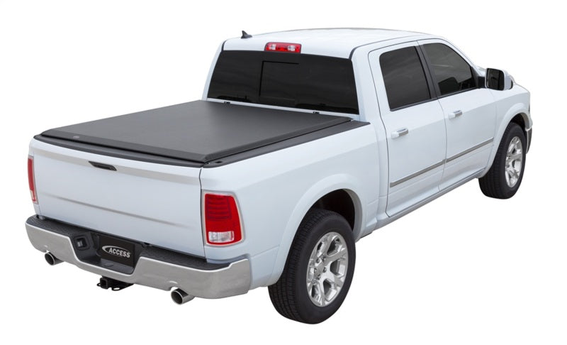 Access Limited roll-up truck bed cover on a Dodge Dakota crew cab with utility rails, designed for 08-11 models.