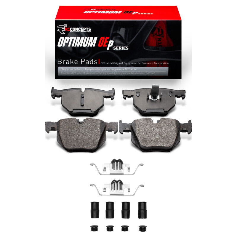 R1 Concepts BMW 525XI rear OE brake pads and hardware kit, showing metal components and packaging for vehicle braking system.