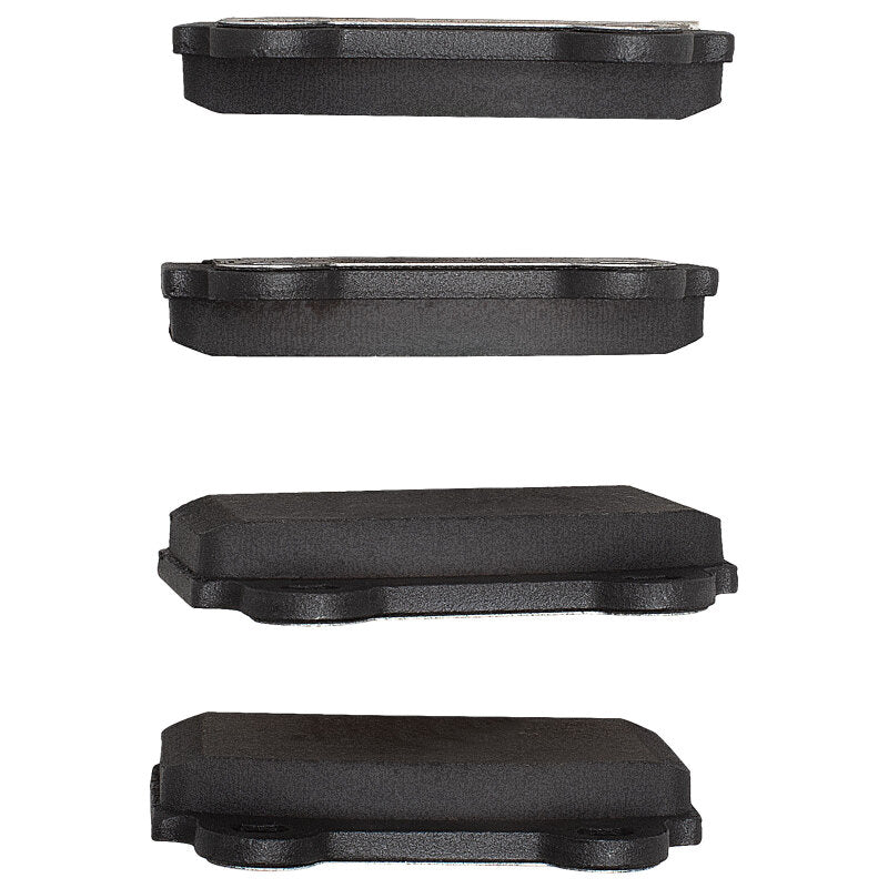 R1 Concepts ceramic rear brake pads for Mitsubishi Lancer 2008-2015, OE style, shown in black with metal backing plates.
