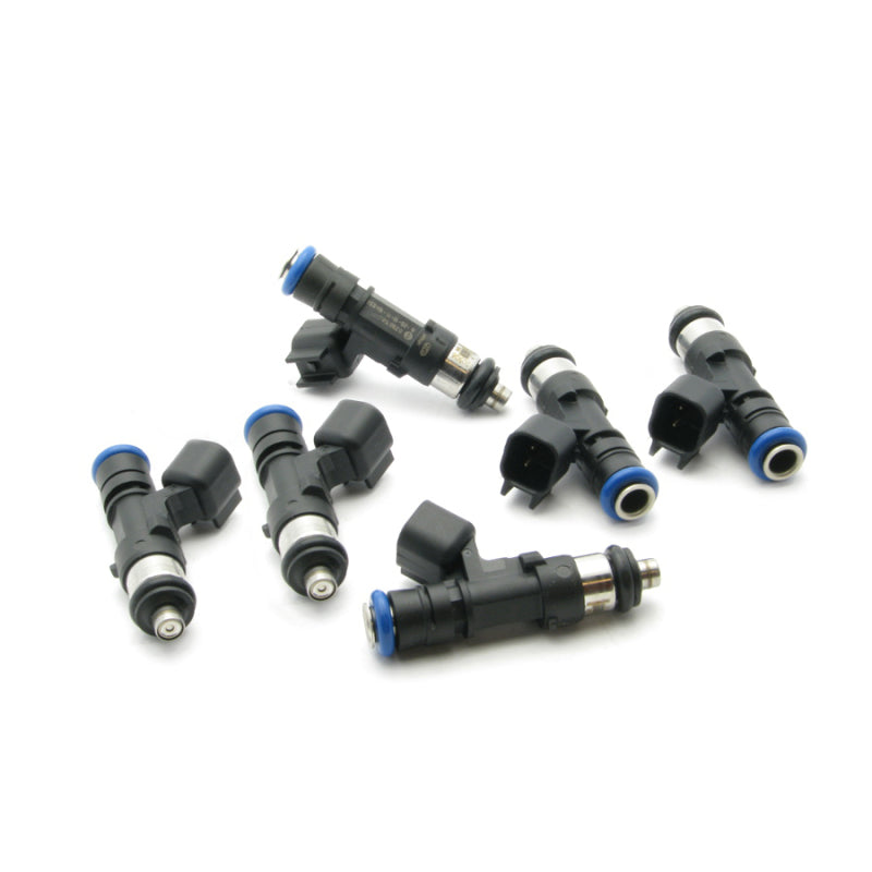 Set of six DeatschWerks 750cc fuel injectors for Nissan GTR VR38DETT 6-cylinder engine, shown in the image.