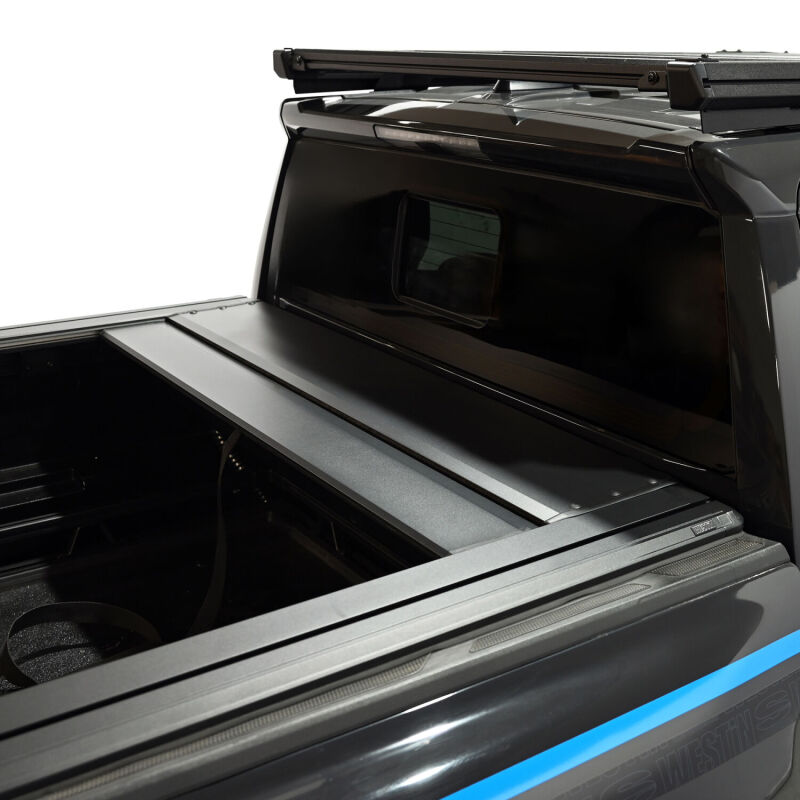 Westin black 5ft roll-up tonneau cover for Toyota Tacoma 24-26, manual retractable bed cover, durable and secure.