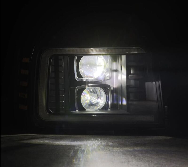 AlphaRex PRO-Series projector headlights with black housing, sequential signal, and daytime running lights for Ford F-Series and Bronco (92-96).