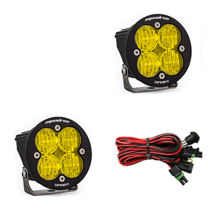 Pair of Baja Designs Squadron R Sport LED light pods with wide cornering amber lenses for off-road vehicles.