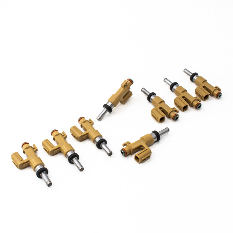 Set of 8 DeatschWerks 650cc fuel injectors for 2007-2015 Toyota Tundra, Sequoia, Land Cruiser, 8-cylinder engine, shown in image.