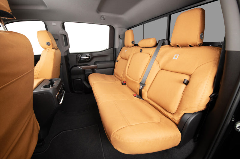 Covercraft Carhartt custom second row seat covers for Toyota Grand Highlander, durable fabric with a fitted, protective design.