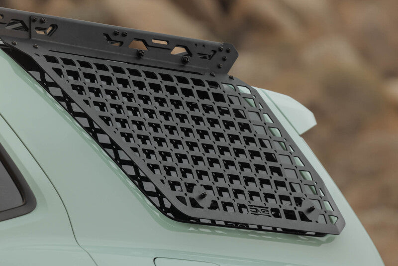 DV8 Offroad exterior trim for Toyota 4Runner 25-26 driver side window Molle on roof rack, showing rugged metal design.
