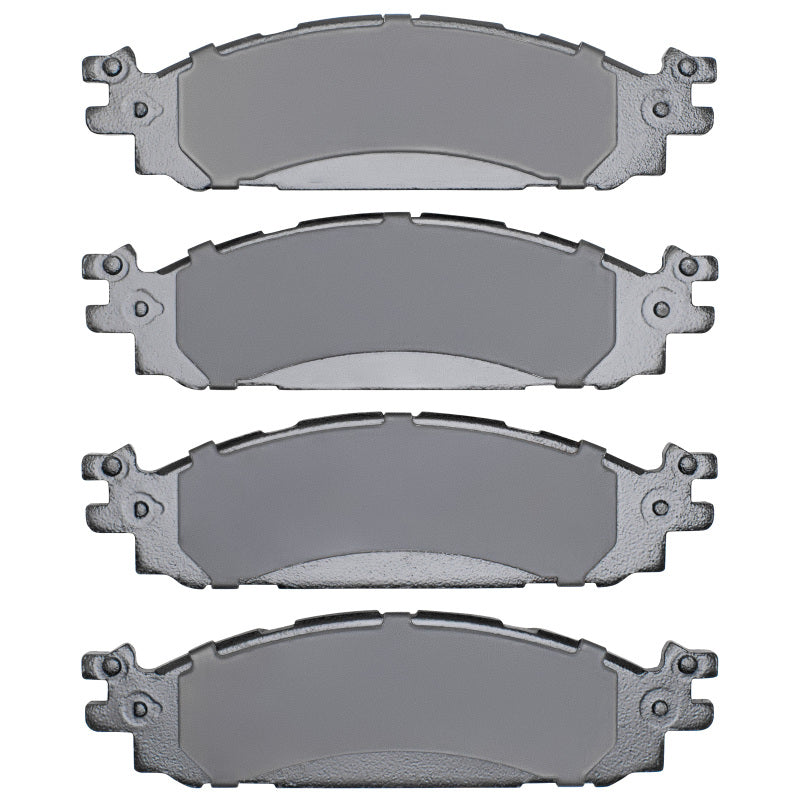 R1 Concepts ceramic front brake pads for Ford Taurus 09-19, OE replacement brake pads, black with metal backing plates.