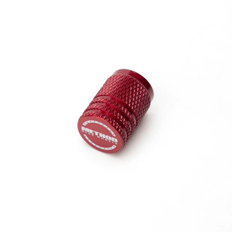 Set of five red Method Wheels valve stem caps, durable metal caps for car tires, with a sleek, vibrant red finish.