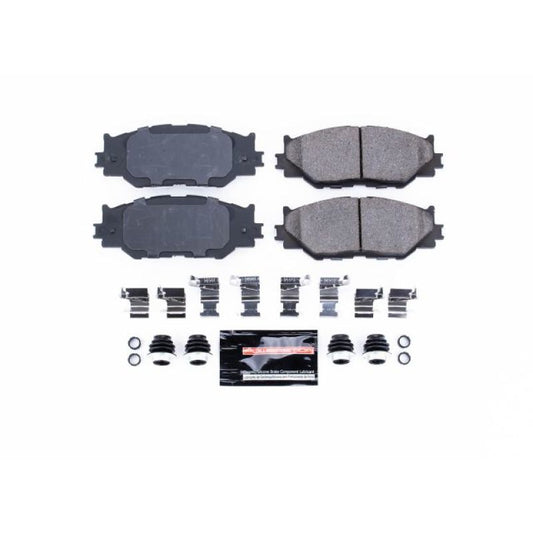 PowerStop Z23 Evolution Sport brake pads with hardware installed on a Lexus IS250 front brake assembly.