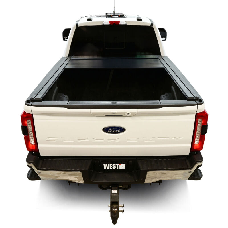 Westin roll-up tonneau cover for Ford F-250/F-350/F-450/F-550 SD 6ft 10in bed in black, manual retractable design.