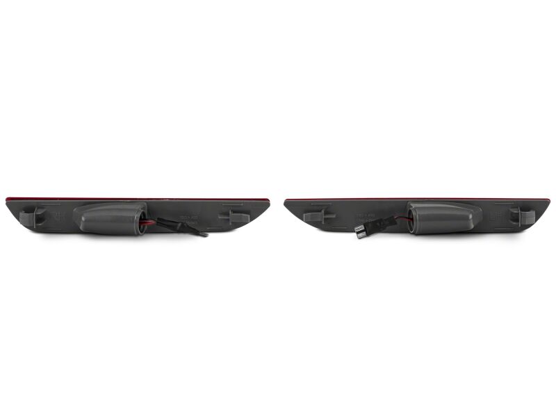 Red Raxiom 15-23 Ford Mustang Axial Series LED rear side marker lights installed on the vehicle.